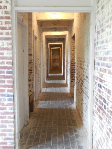 Hall of doors - those on the left lead to storage rooms and those on the right to the servants' rooms