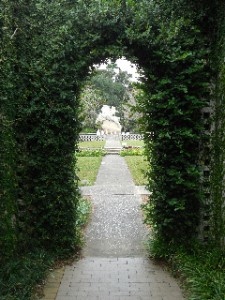 Archway leading to a sculpture and fountain