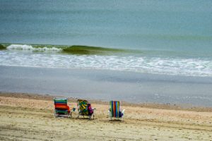 Beach chairs on a misty morning