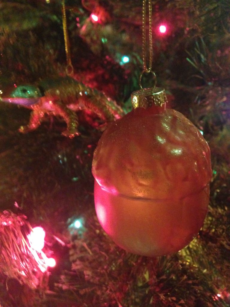 A blown-glass acorn ornament